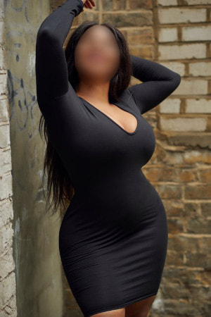 Shapely ebony girl in a tight black dress