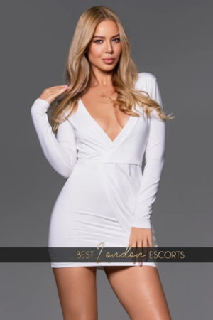 Tall slender beautiful Russian woman in a white dress